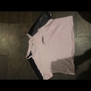 Light pink crop top with black mesh for sleeves.